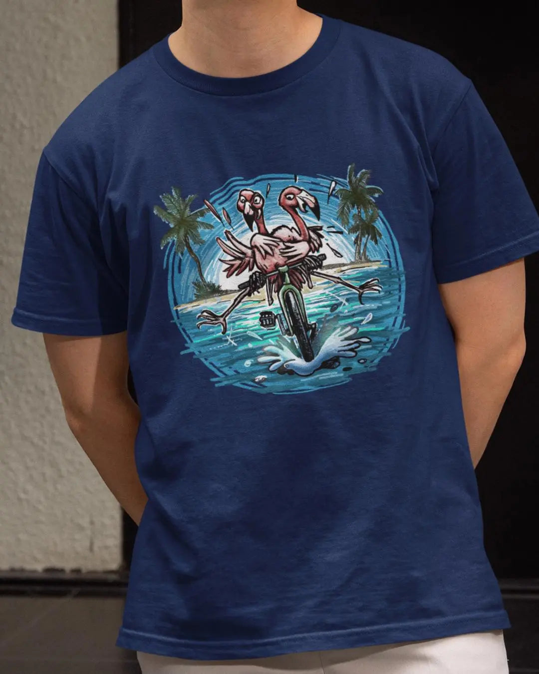 A Colorful Duo of pink Flamingos Riding a Bike at the Beach - Bike T-Shirt